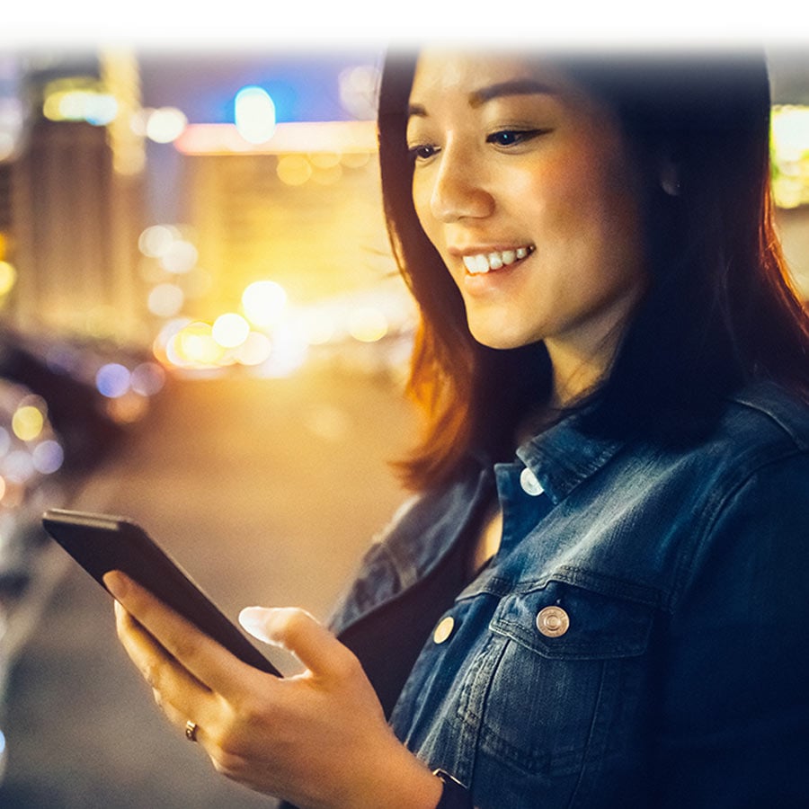 woman of Asian descent receiving payments on her phone 